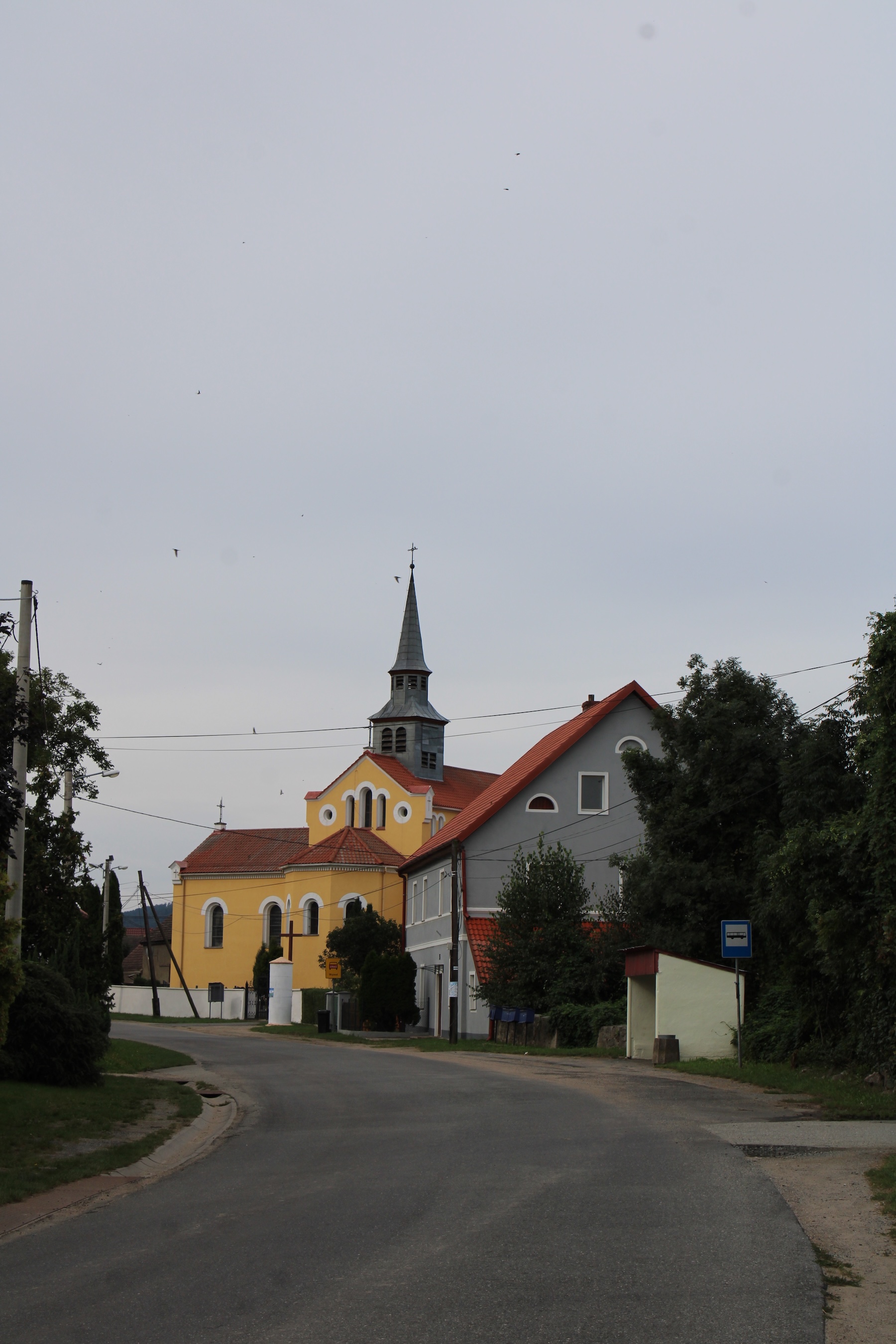 A church in Ozary. Overcast sky. Wonderful paint on the church.